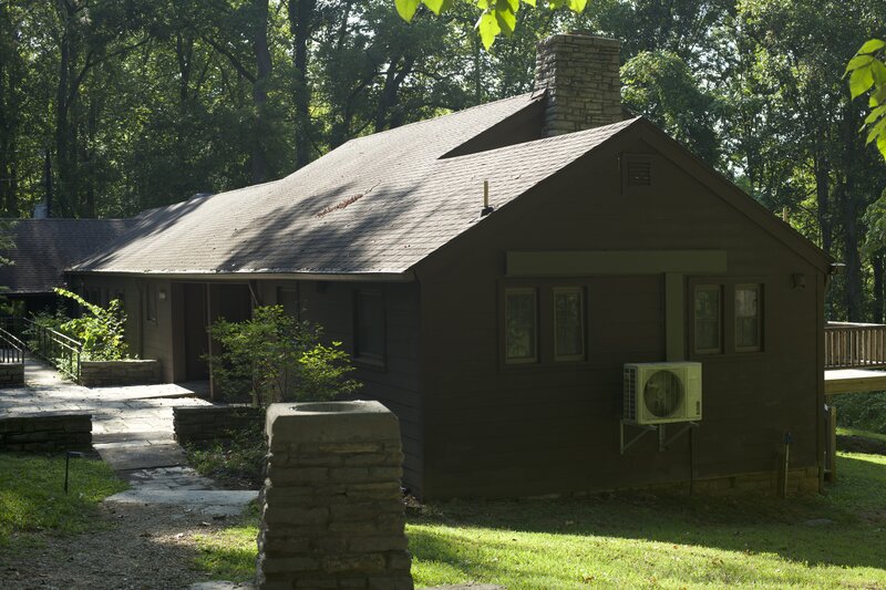 The trail starts at the Tea Room in the old CCC Camp. The trail descends into the woods on the right hand side of the building.