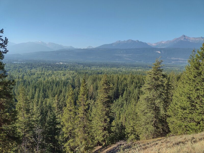 Looking southwest from near the Swift Creek Lookout, Valemount is in the valley below (left). Mountains in the distance with glaciers sprinkled among them, if you look closely.