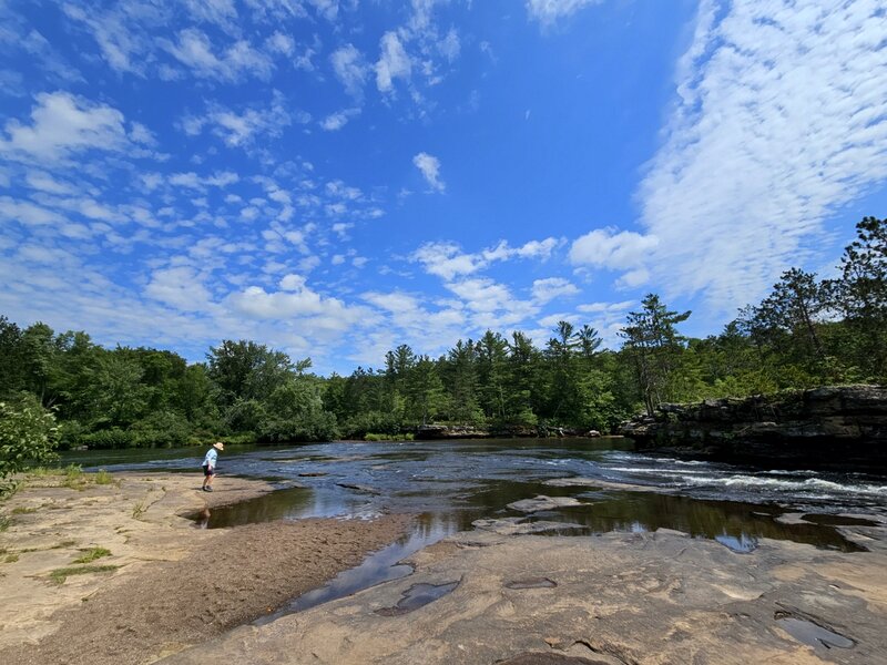 On the sandstone ledges above the falls.