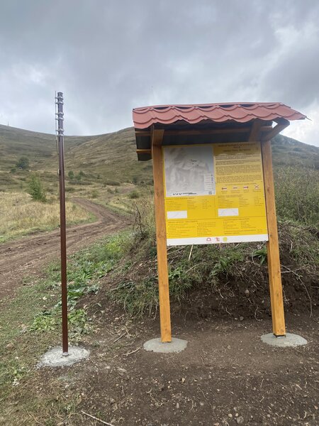 Trailhead and parking area with information.