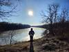 Gazing at the frozen Minnesota River during a hike in winter.