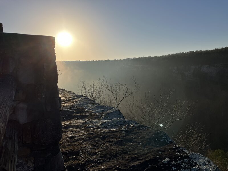 The edge of the cliff, at sunrise.