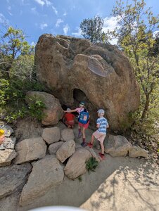 Our kids, ages 8, 6, and 4, exploring the boulders and caves.