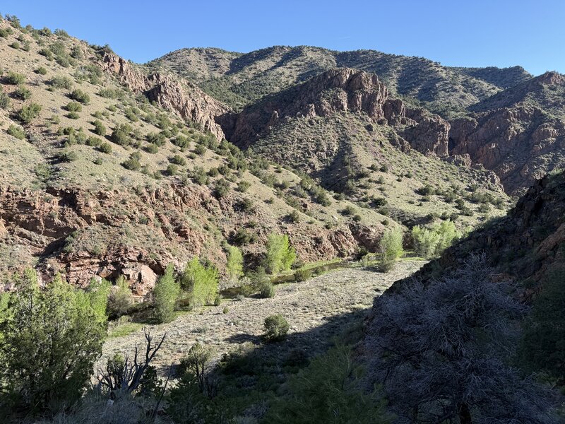 Looking down at the trail in the valley that runs along the river.