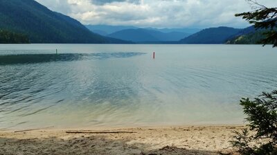 Upper Priest Lake, looking north from the sandy beach at Geisinger trail camp. The red and green buoys mark the Thorofare channel that connects Upper Priest Lake to Priest Lake.