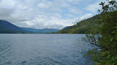 Upper Priest Lake, looking north as the trail runs along its shoreline.  Sandy beaches (right center) ahead await hikers who are looking for a break.