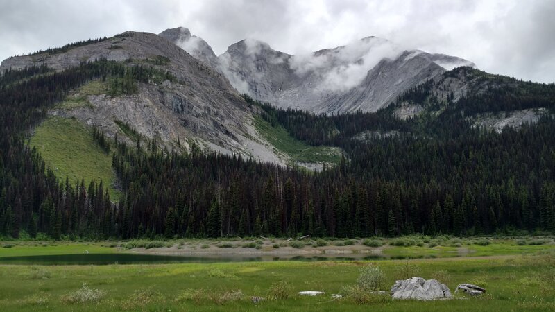 Tiny Fox Lake along Upper Elk Lake Trail, with Mount Fox, 9.754 ft., on the Great Divide (and Alberta/British Columbia border), behind it.