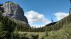 Impressive rock walls rise above the trail as it travels through the meadows of Eagles Nest Pass, 6,201 ft. Eagles Nest Pass is a gap in the Persimmon Range.