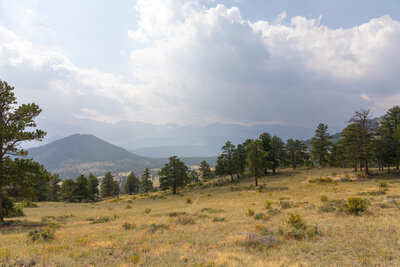 Thunderstorm clouds slowly developing over Beaver Meadows.