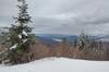 Twin Lakes below (center) nestled in the nearby, forested Rathdrum hills, with more mountains in the distance, on a gray, winter February afternoon. Seen looking east from a nice viewpoint along Upper Outer Limits.