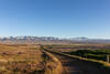 Approaching highway 138 with the snow covered Tehachapi Mountains in the distance.