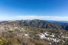 Burnt Peak and Sawmill Mountain with the snow covered San Gabriel Mountains in the distance.