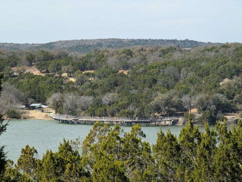 View looking across the lake from the Tucker Lake trail to the fishing pier area.