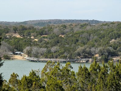 View looking across the lake from the Tucker Lake trail to the fishing pier area.