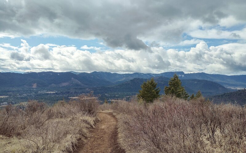 Mountains and hills everywhere, are seen looking southwest from the John Wayne Trail on the slopes of Peewee Peak.