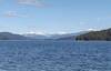Looking north up Priest Lake (zooming in), nearby land (right) is Bartoo Island. Lookout Mountain (right) is behind Bartoo Island. Tiny Papoose Island is on the far left. All the mountains center left, are more of the Selkirks and far, far, away.