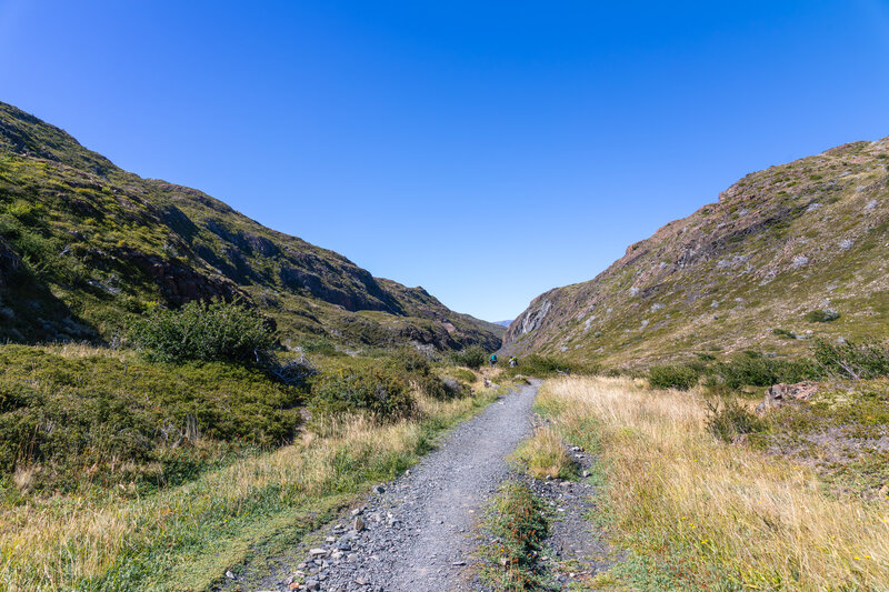 A narrowing green valley from Laguna Los Patos to Lago Pehoé.