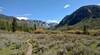 The trail runs in the wide, flat New Fork River valley, as it heads towards the narrow, rugged New Fork Canyon in the distance (center).