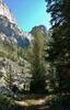 Cliffs of the narrow Reynolds Creek canyon, with Palmer Lake Trail passing at the bottom of the cliffs.