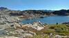 Cutthroat Lake. Looking east from above, on Doubletop Mountain Trail. In the far distance, highest peaks of the Wind Rivers "spine" poke up above the nearer hills.