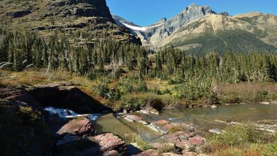 The Helen Lake outlet creek, with its small waterfall on the left. Old Sun Glacier (top center).