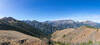 Standing at the true summit of Mount Howard (8,244 ft), a sweeping panorama unfolds across the Royal Purple Creek canyon toward the glaciated high peaks of the Eagle Cap Wilderness, from Bonneville Mountain to Sacajawea Peak and The Matterhorn.