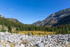 A wide expanse of frost-shattered granodiorite boulders opens onto the broad floor of the upper East Lostine River Valley at 7,000 feet.
