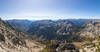 From an upper switchback on Eagle Cap at 9,186 ft, an expansive 180-degree panorama reveals the monumental glacial abyss of the East Fork Eagle Creek valley plunging southward toward the wilderness boundary.