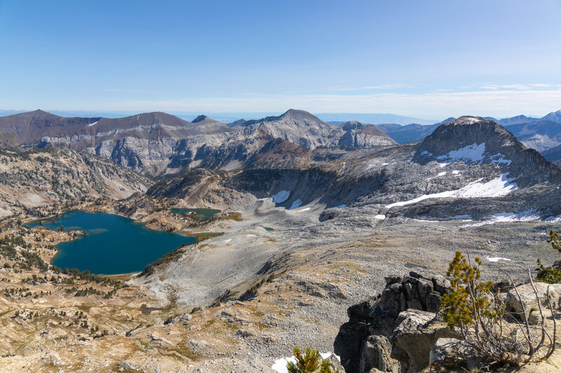 From the 9,562 ft summit stance of Eagle Cap, a dramatic wide-angle vista opens east-southeast across the glaciated amphitheater cirque cradling the sapphire waters of Glacier Lake (8,166 ft) and Upper Glacier Lake.